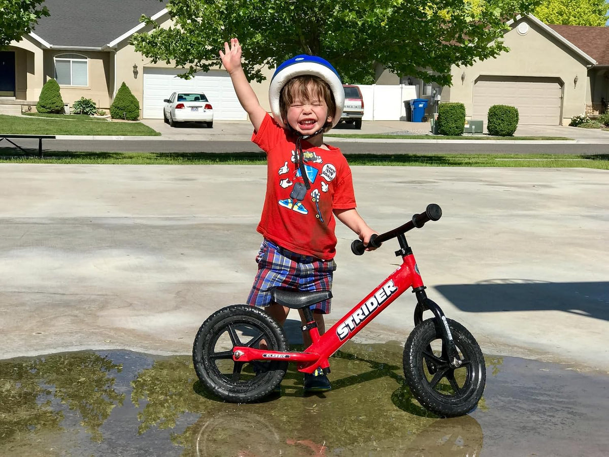 Strider 12” Classic Bike - No Pedal Balance Bicycle for Kids 1 to 3 Years - Includes Built-In Footrest, Handlebar Grips & Flat-Free Tires