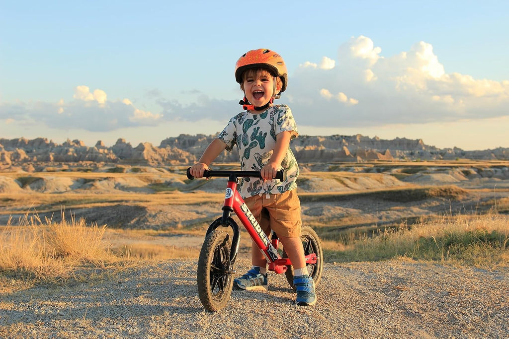 Strider 12” Classic Bike - No Pedal Balance Bicycle for Kids 1 to 3 Years - Includes Built-In Footrest, Handlebar Grips & Flat-Free Tires